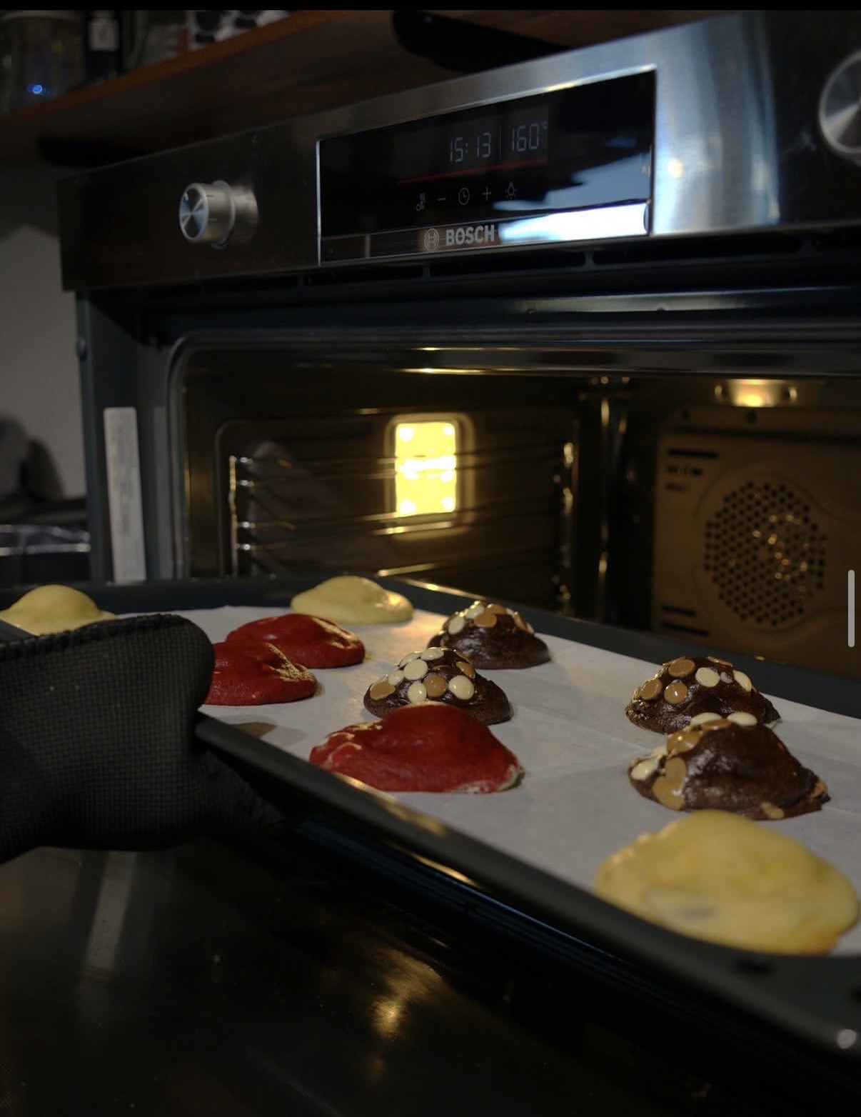 Cookies going into the oven on a baking tray