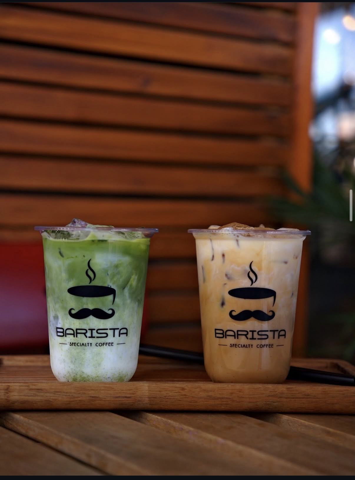 Iced matcha latte and iced coffee in Barista cups