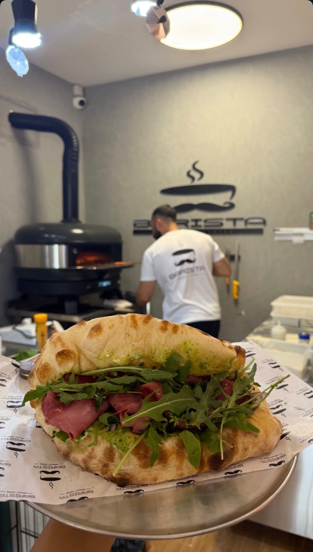 Roast beef sandwich in front of the taboon oven