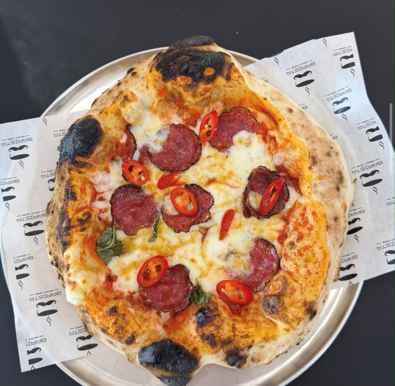 Wood-fired salami pizza with fresh chilli